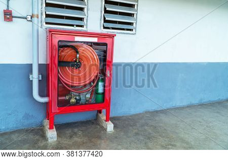 Fire Extinguishers Prepare In The Event Of Fire, Fire Protection Equipment In A Red Box Beside The C