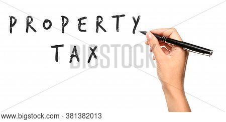 Woman Writing Phrase Property Tax On White Background, Closeup. Banner Design