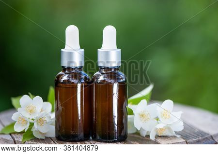 Essential Jasmine Oil. Bioproduct, Organic Cosmetics. Perfumery, Cosmetology, Aromatherapy
