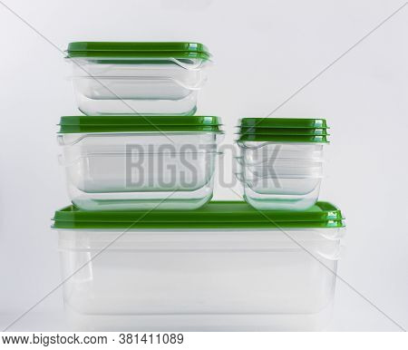 Empty Plastic Food Containers Are Stacked On A White Background.