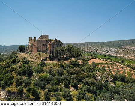 Aerial High Up Photography Drone Point Of View Of Ruins Of The Castle Of Montesa Located On Hillside