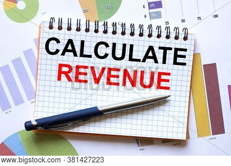 Notepad With Text Calculate Revenue On Business Charts And Pen