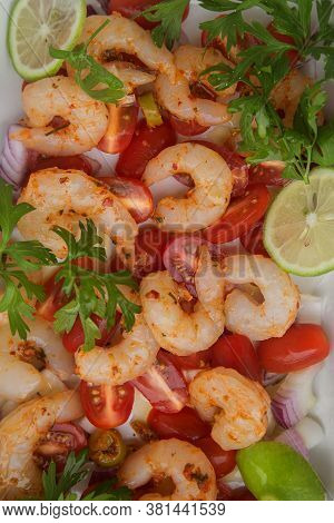 Fresh Raw Peeled Prawns With Sliced Cherry Tomatoes, Herbs And Spices.