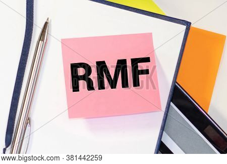 Businessman Hand With Pen Pointing To Rmf Sign On The Paper.