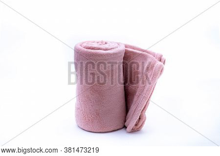 Rolled Up Red Coral Fleece Throw Isolated On White Background