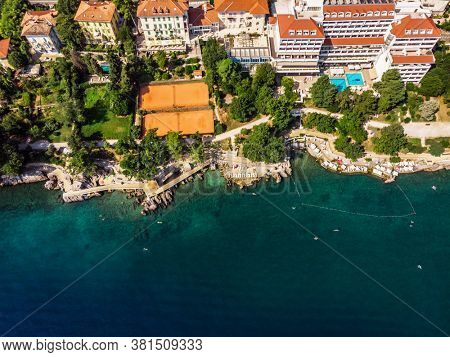 Beautiful panoramic view of Lovran village and its sea shore in Croatia. Top view photo taken on drone.