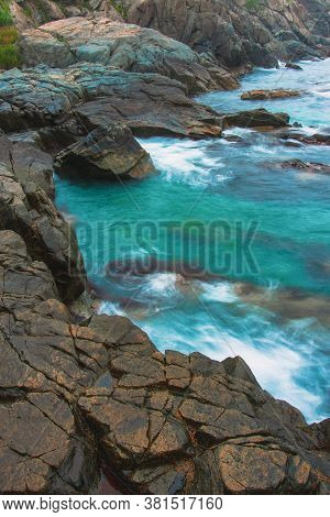Rocky Sea Shore, Cliffs With Surf On The Gamova Peninsula In The Primorsky Territory, Seascape Of Ru