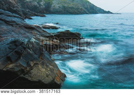 Rocky Sea Shore, Cliffs With Surf On The Gamova Peninsula In The Primorsky Territory, Seascape Of Ru