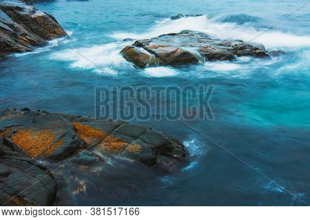 Rocky Sea Shore, Cliffs With Surf On The Gamova Peninsula In The Primorsky Territory, Seascape Of Ru