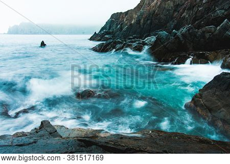 Rocky Sea Shore, Cliffs With Surf On The Gamova Peninsula In The Primorsky Territory, Seascape Of Ru