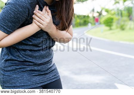 Exhausted Female Runner Suffering Painful Angina Pectoris Or Asthma Breathing Problems After Trainin