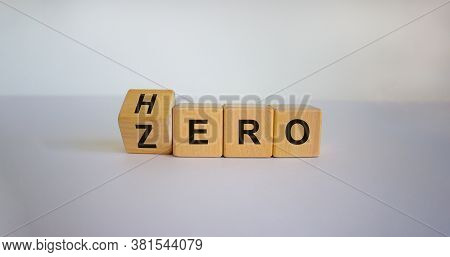 From Zero To Hero Concept. Hand Turns A Cube And Changes The Word 'zero' To 'hero'. Beautiful White 