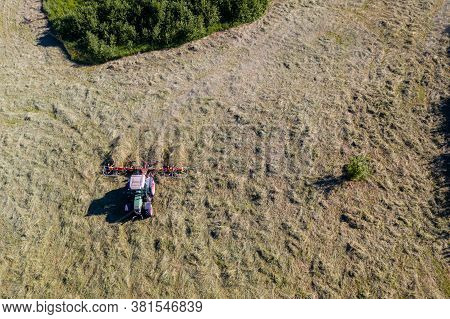 Top View Of Tractor With Tedders, Drying Mowed Hay