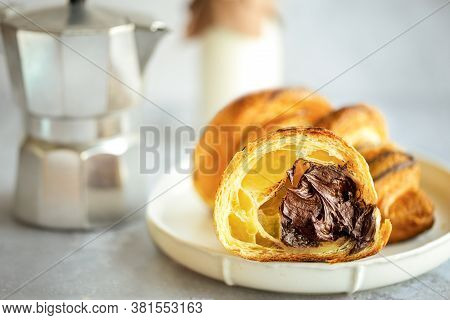 Chocolate croissant. Croissant with chocolate filling. Sliced ​​croissant with chocolate. Delicious 