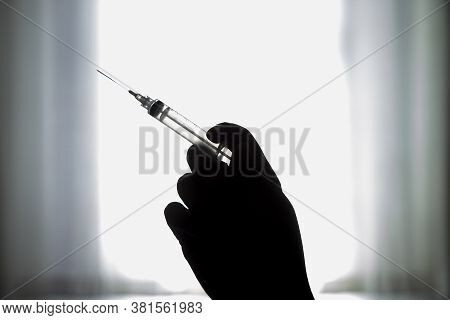 Syringe With Vaccine\preventing The Coronavirus Or Covid-19 Pandemic