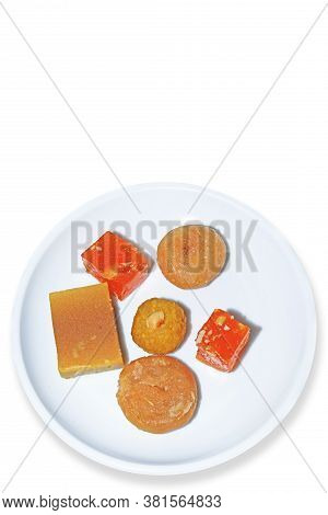 Indian Sweets On A White Plate For The Festival Celebrations