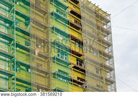 Scaffolding Arround The House To Install Thermal Insulation Of The Apartment Building Facade