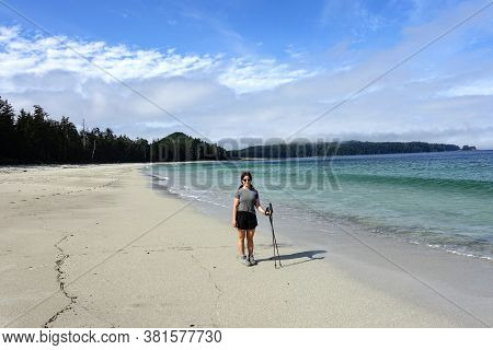 A Female Hiker Posing For A Photo By The Sandy Beaches Of Nels Bight And Experimental Bight, Beside 