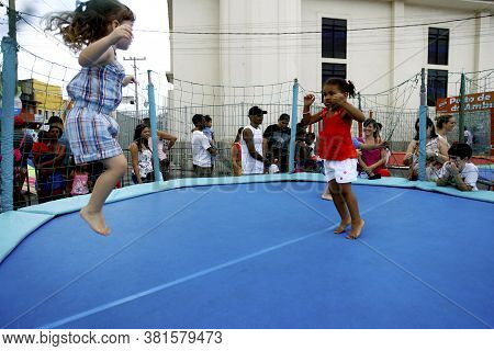 Salvador, Bahia / Brazil - September 21, 2014: Child Is Seen Playing In The Rio Vermelho Neighborhoo