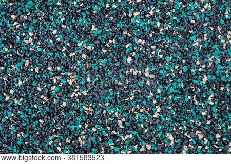 Texture Of The Street Pavement Of Tracks Made Of Rubber Granular Crumb. Granulate Close-up.