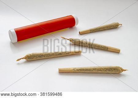 A Cannabis White And Red Plastic Packaging Container For Prerolls Or Joints With Pre-rolls Cannabis 