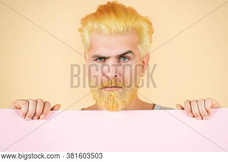 Colorful Studio Portrait Of Serious Man Close Up On Isolated Yellow Background