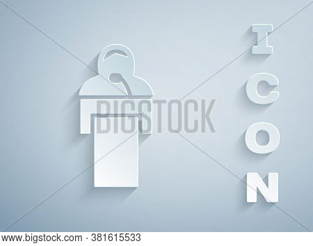 Paper Cut Gives Lecture Icon Isolated On Grey Background. Stand Near Podium. Speak Into Microphone. 