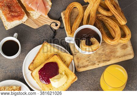 Spanish Breakfast, Bruschetta With Jamon (cured Ham) And Tomatoes, Churros With Chocolate,  Magdalen
