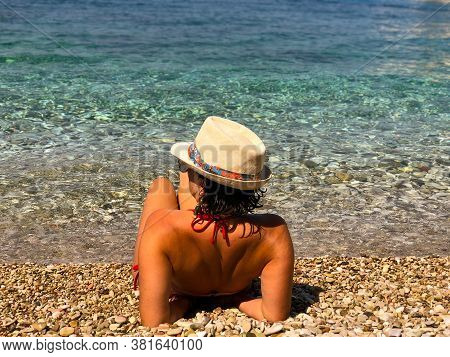 Woman With Bikini Sitting Close To The Beach.ionian Sea Albania