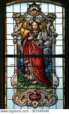 PESCENICA, CROATIA - SEPTEMBER 07, 2013: Sacred Heart of Jesus, stained glass window in Parish Church of the Assumption of the Virgin Mary in Pescenica, Croatia