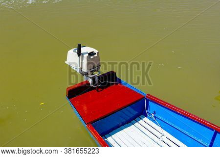 Colorful Fishing Boat Anchored On The River.