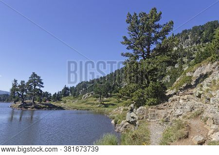Lake Achard Rocky Shores In Chamrouse Mountain Range