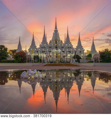 White Pagoda Or Stupa Of Asok Maharat Buddhist Temple At Sunset, Samut Prakan Province, Thailand. Th