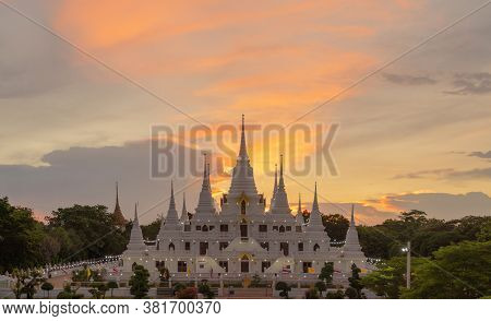 White Pagoda Or Stupa Of Asok Maharat Buddhist Temple At Sunset, Samut Prakan Province, Thailand. Th