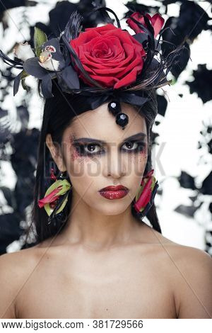 Pretty Brunette Woman With Rose Jewelry, Black And Red, Bright Make Up Kike A Vampire Closeup Red Li
