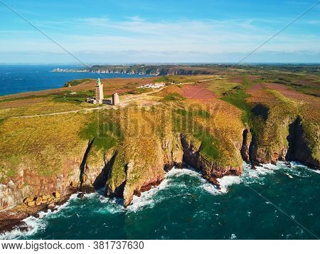 Scenic View Of Cape Frehel With Its Lighthouse, One Of The Most Popular Tourist Destinations In Brit