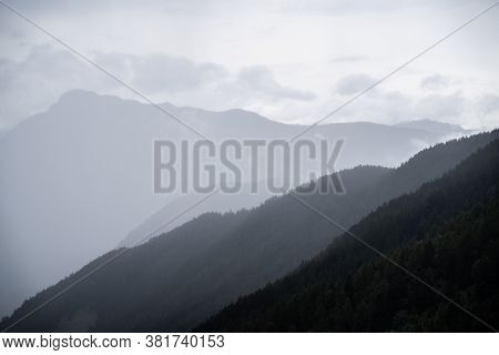 Gray Dark Mountain Landscape With Fog And Clouds