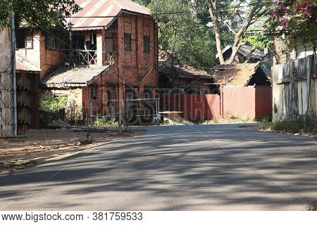 Alleyway And Old Style Of House In The Middle Of Yangon City, Myanmar.