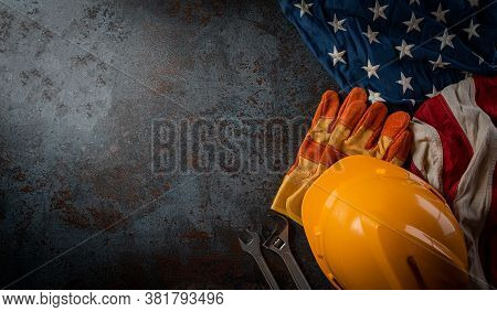 Happy Labor Day Concept. American Flag With Different Construction Tools On Dark Stone Background, W