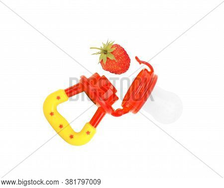 Baby's Nibbler And Ripe Strawberry On White Background