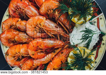 Shrimps With Lemon And Black Pepper On Dark Background Top View