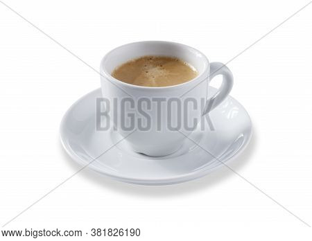 Angled View Of A White Expresso Cup And Saucer Full Of Smooth Expresso Coffee, Isolated On White Wit