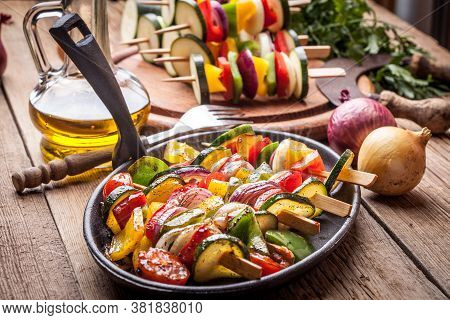 Vegetable Skewers On A Cast Iron Skillet.