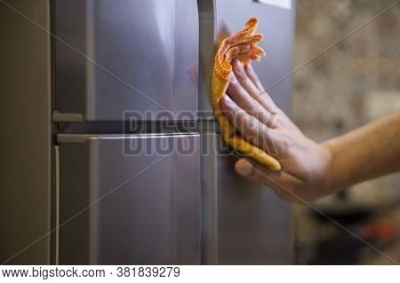 Cleaning The Refrigerator Against Coronavirus During Pandemic In Quarantine