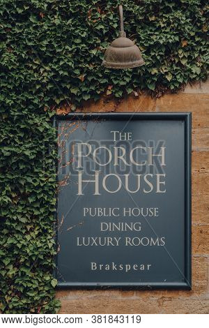 Stow-on-the-wold, Uk - July 10, 2020: Wall Sign On Front Of The Porch House, The Oldest Inn And Pub 