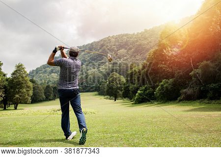 Professional Golfer Taking A Shot. Bali. Indonesia.