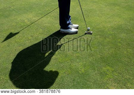 A Person Playing Golf. High Quality Photo