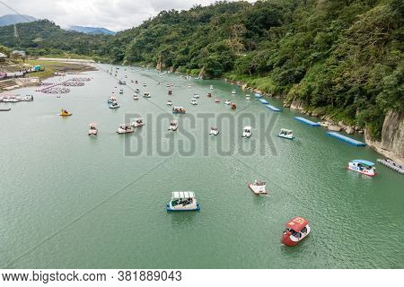 Unidentified People Enjoying Pedal Boats At Bitan Scenic Area