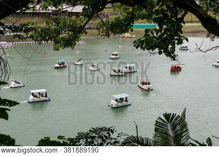 Unidentified People Enjoying Pedal Boats At Bitan Scenic Area