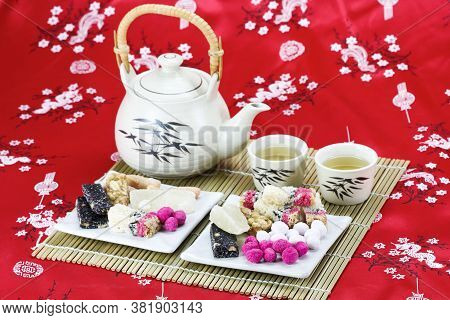 Chinese   Traditional Snacks With Tea On Red Table